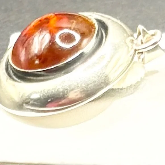 A Sterling Silver Round Pendent with a Lg Amber stone